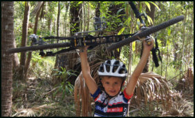 CarbonXS cycles mad 6, kid holding bike