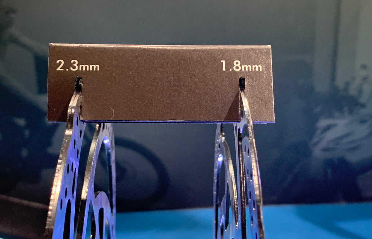 Closeup look at TRP’s hybrid brake pistons, thicker DH rotors