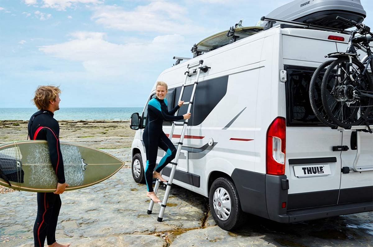 thule collapsible ladder secures to side of vehicle with magnets so it won't slip or wobble