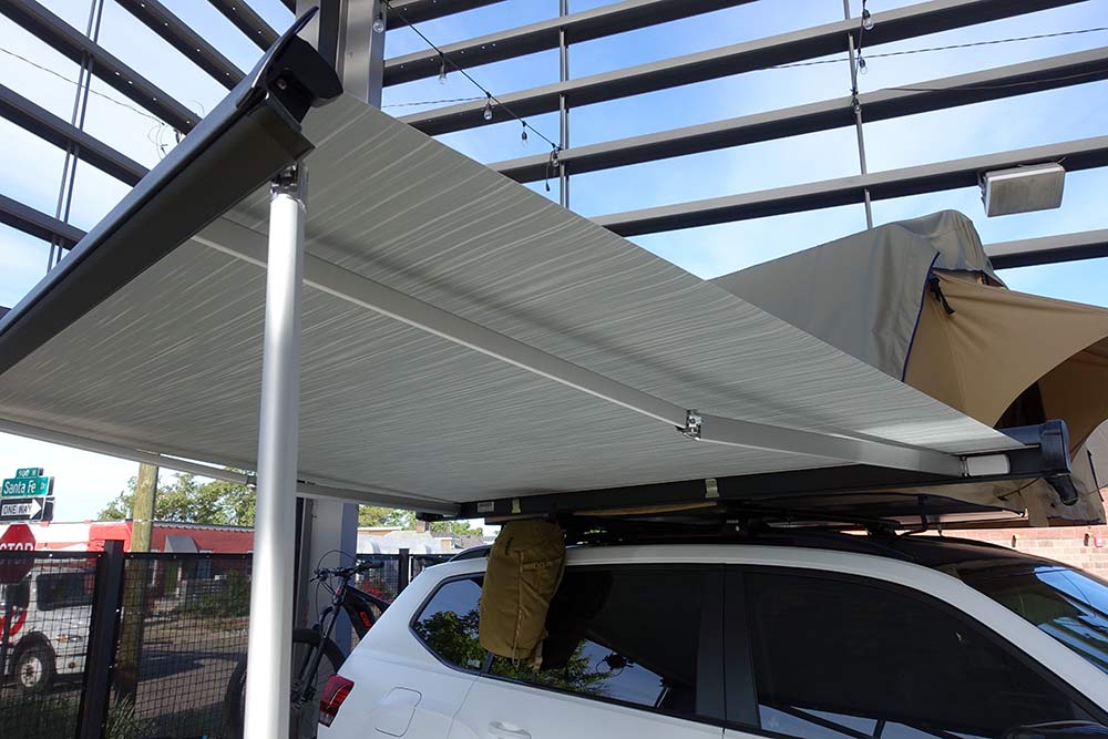 thule roof rack mounted sun shade canopies that roll up