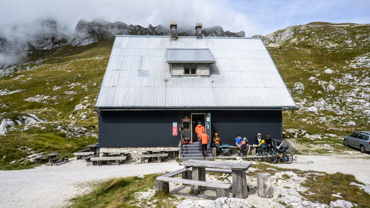 the refuge hut at the top of mangart saddle in slovenia offers beds and food