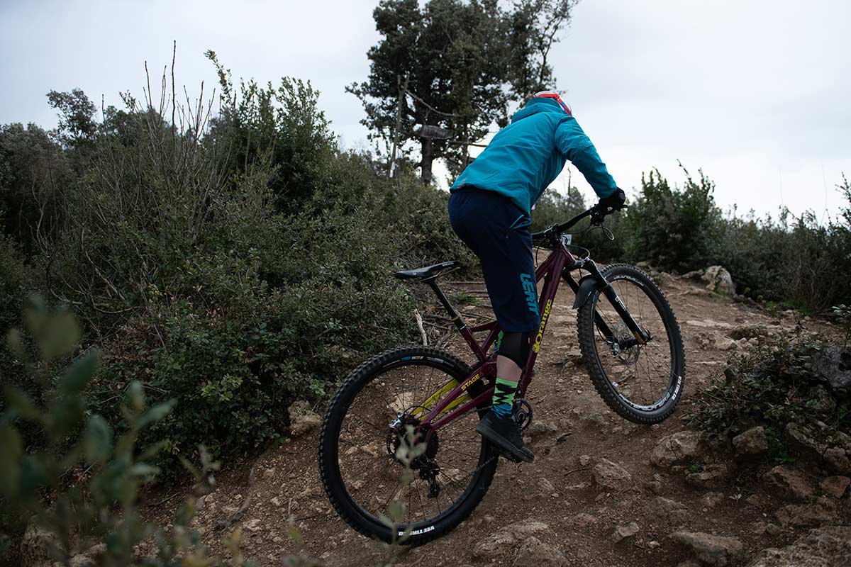 mountain biker climbing rocky singletrack italy