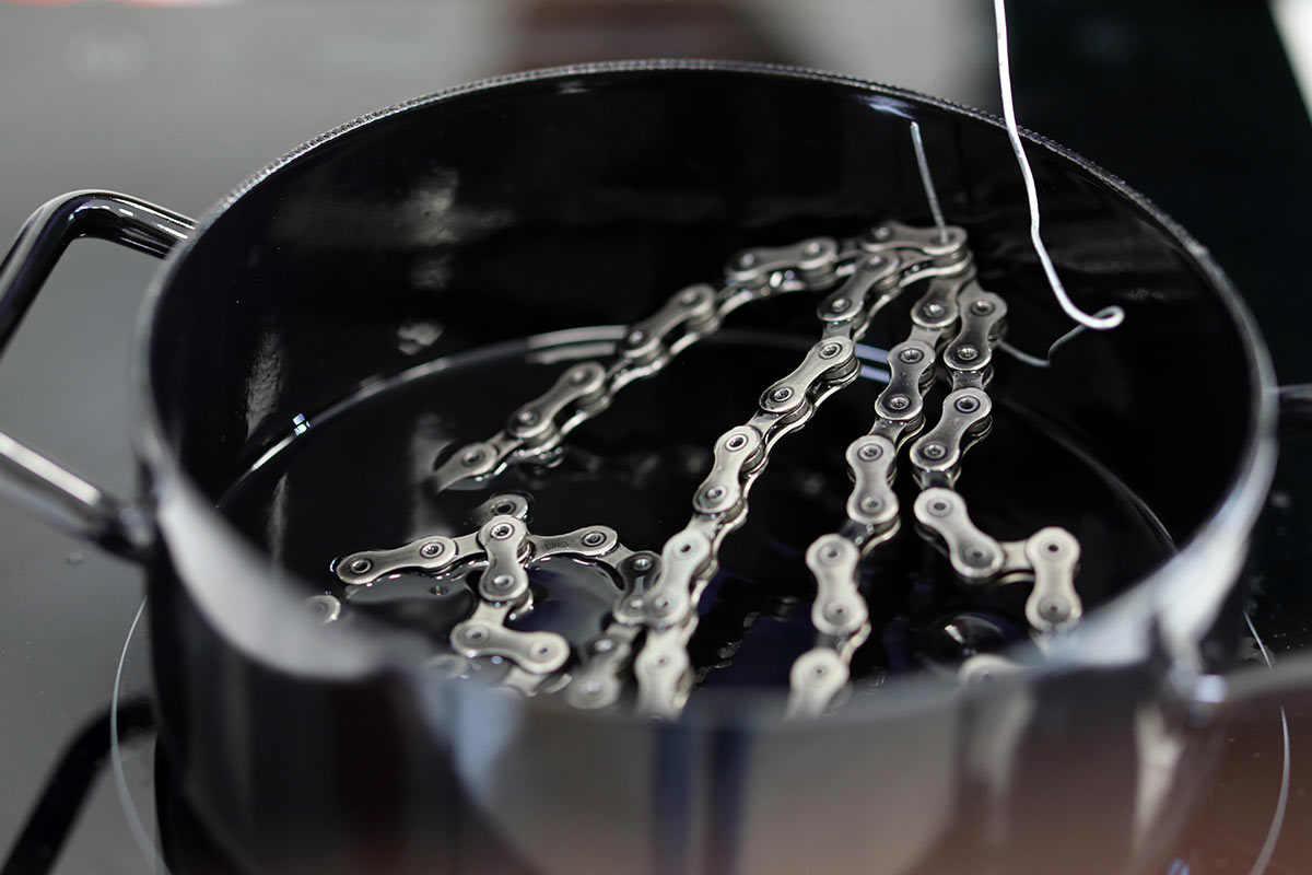 graphenwax graphene infused chain wax lube from absoluteblack melting in a pot