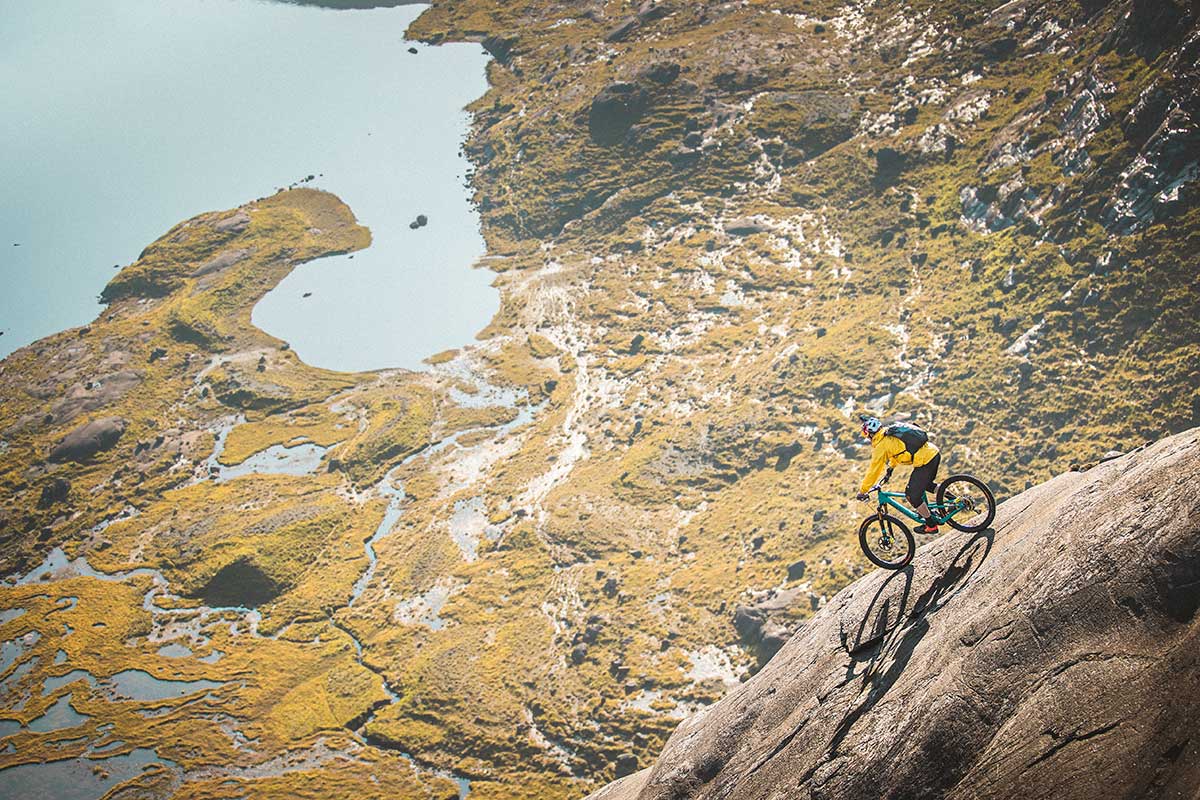 danny macaskill dubh slabs checking line choice steep rock face descent