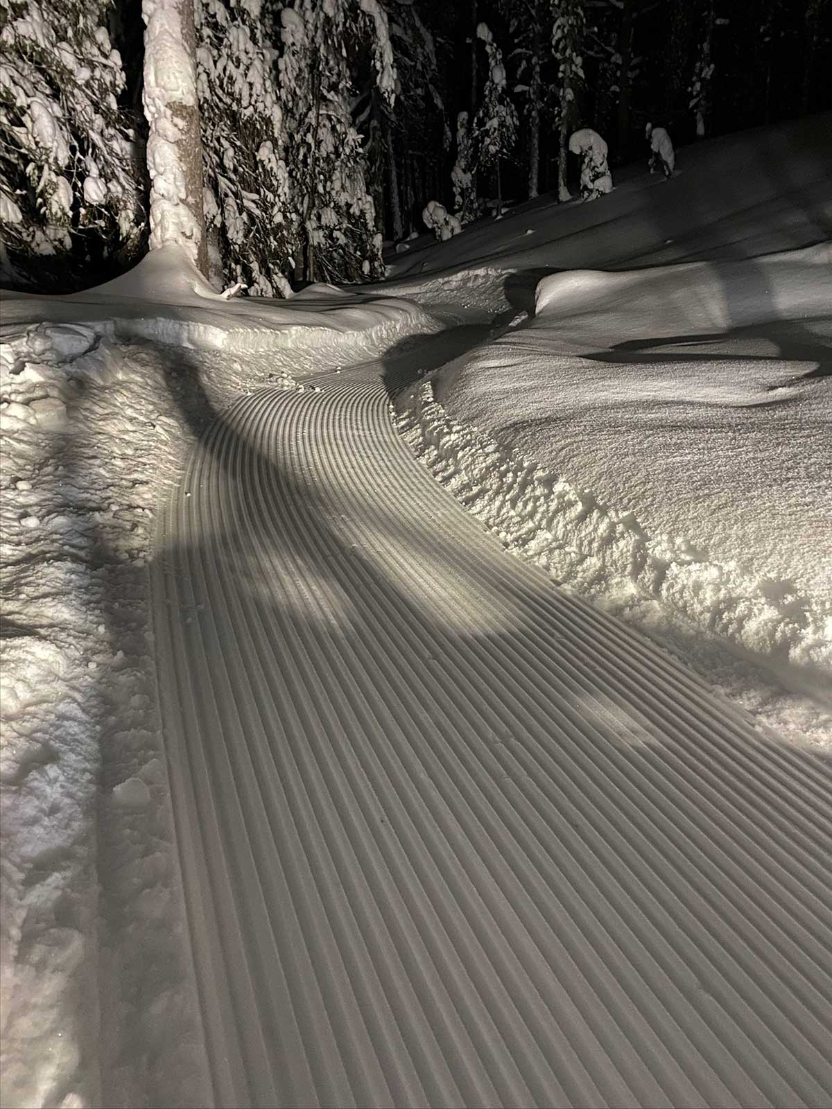 trailander bike route plane smooths snow covered mountain bike trails for fat biking