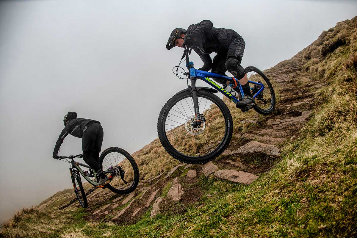 wtb riders decending windy foggy mountain top