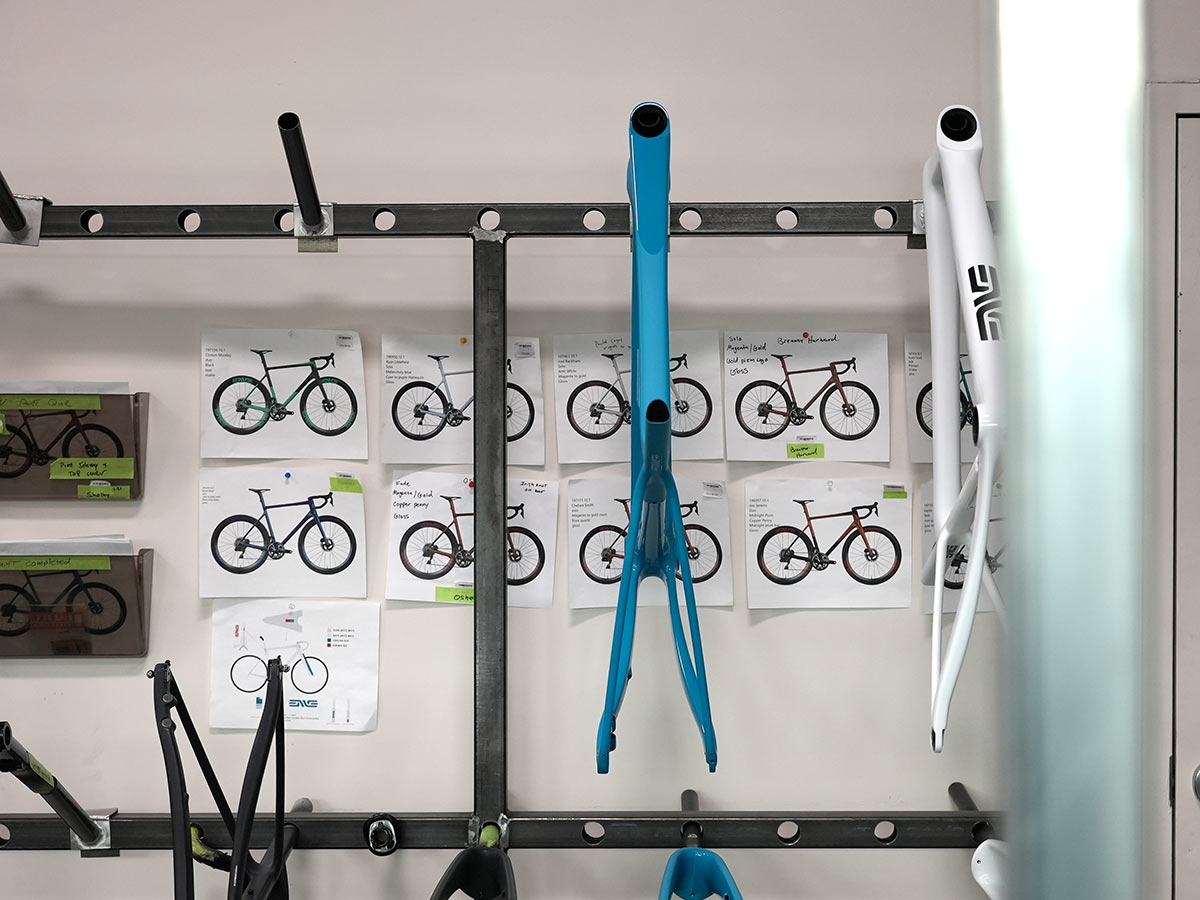 enve custom carbon road bike frame color selection and painted bikes hanging on wall