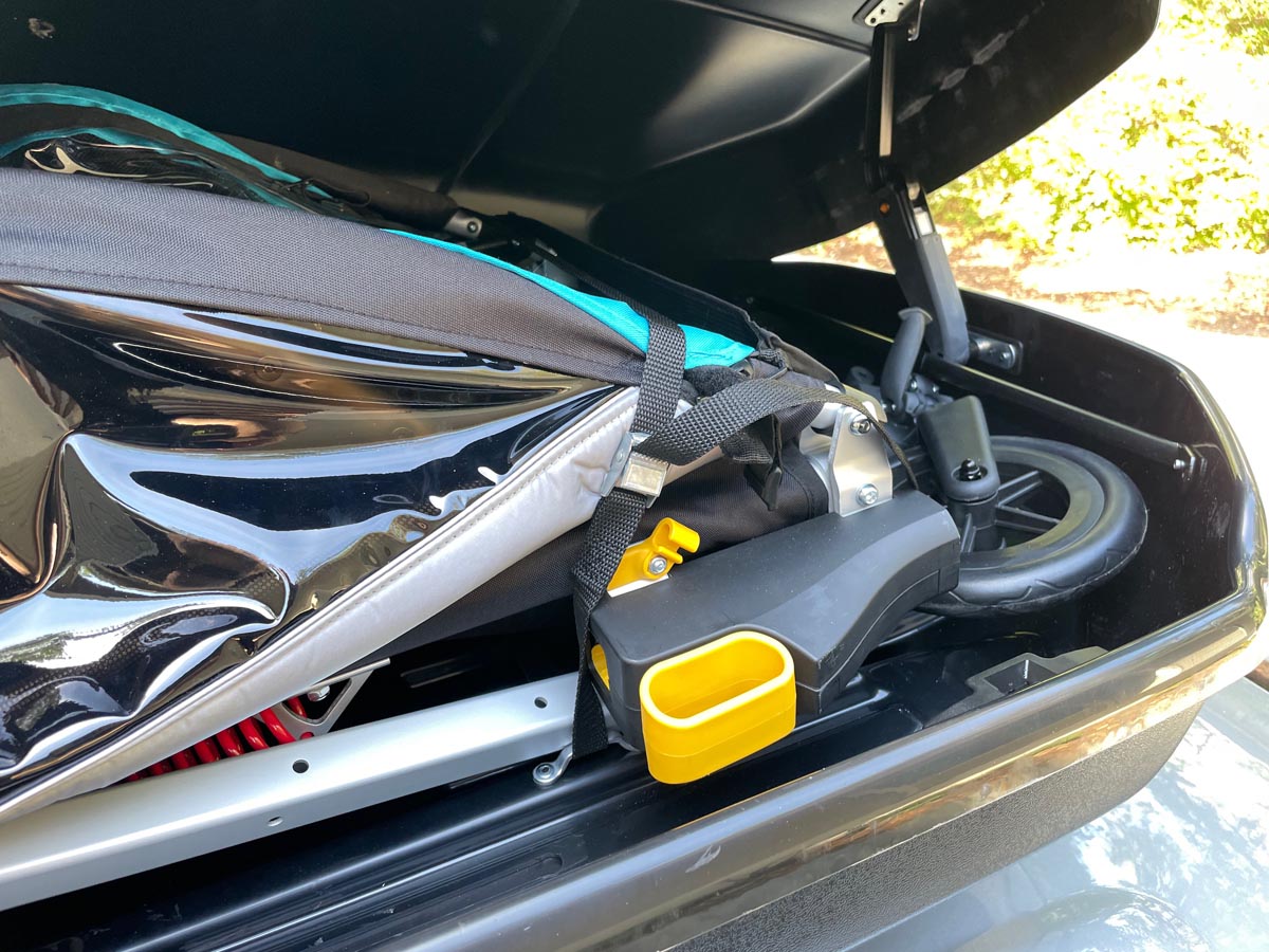 transporting child trailer in roof top cargo box