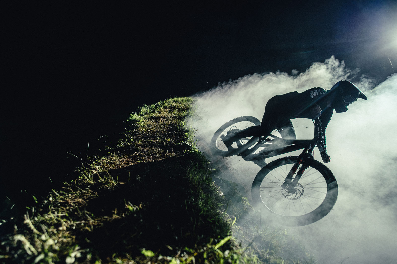 2022 orbea rallon night riding berm dust cloud lit up