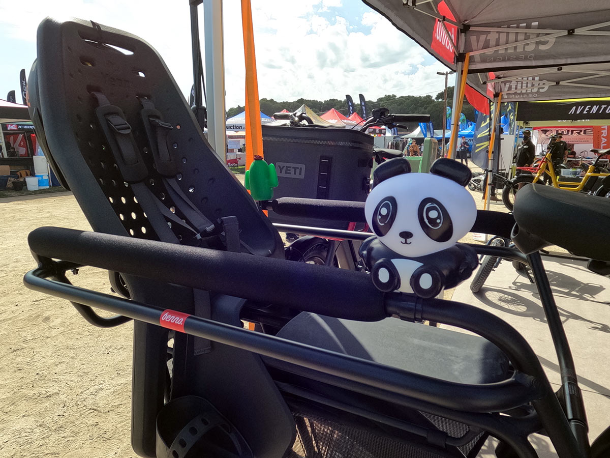 benno boost step-thru e-cargo bike with child seat on rear rack