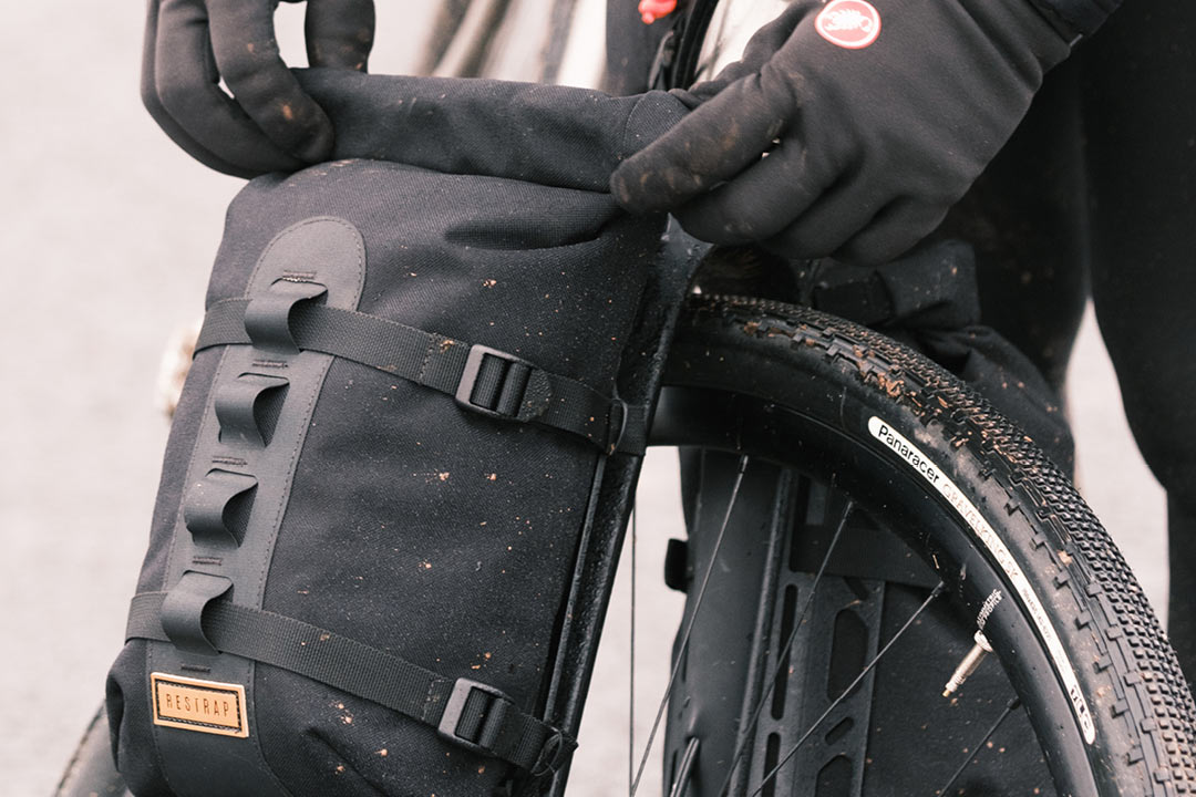 restrap carry cage anything mount accessory mount with dry bag installed on bicycle fork