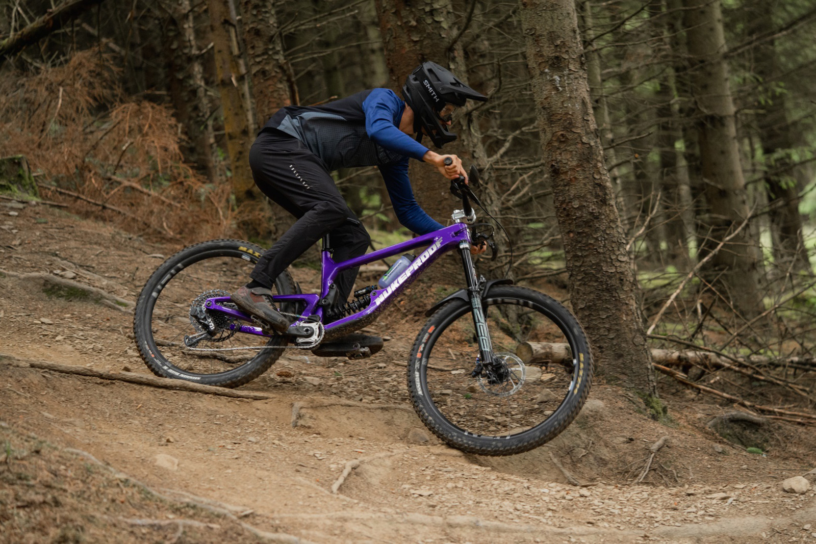 innes graham riding his new nukeproof giga purple with coil shock tweed valley