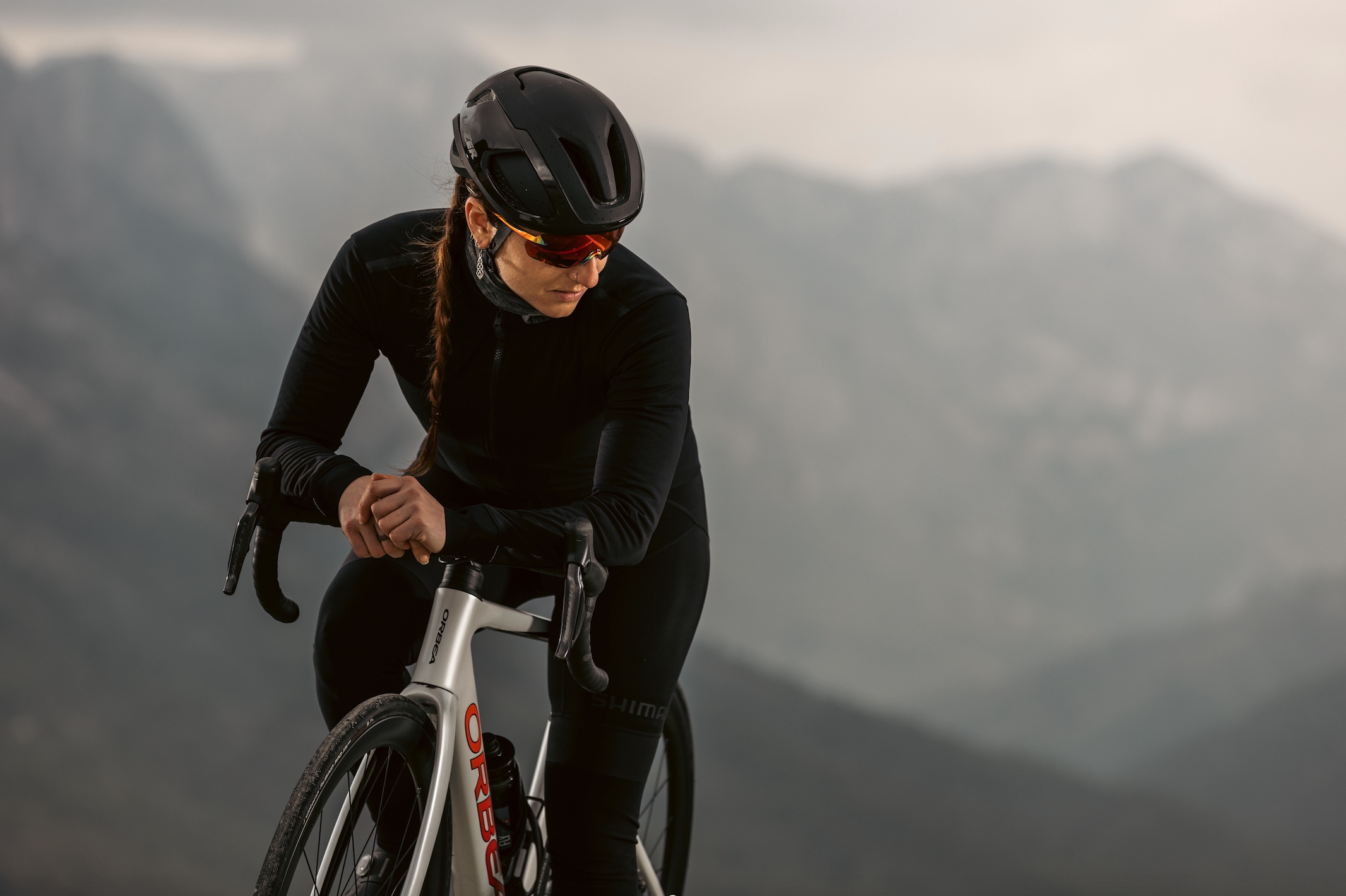 Woman wearing a Lazer Vento Kineticore helmet.
