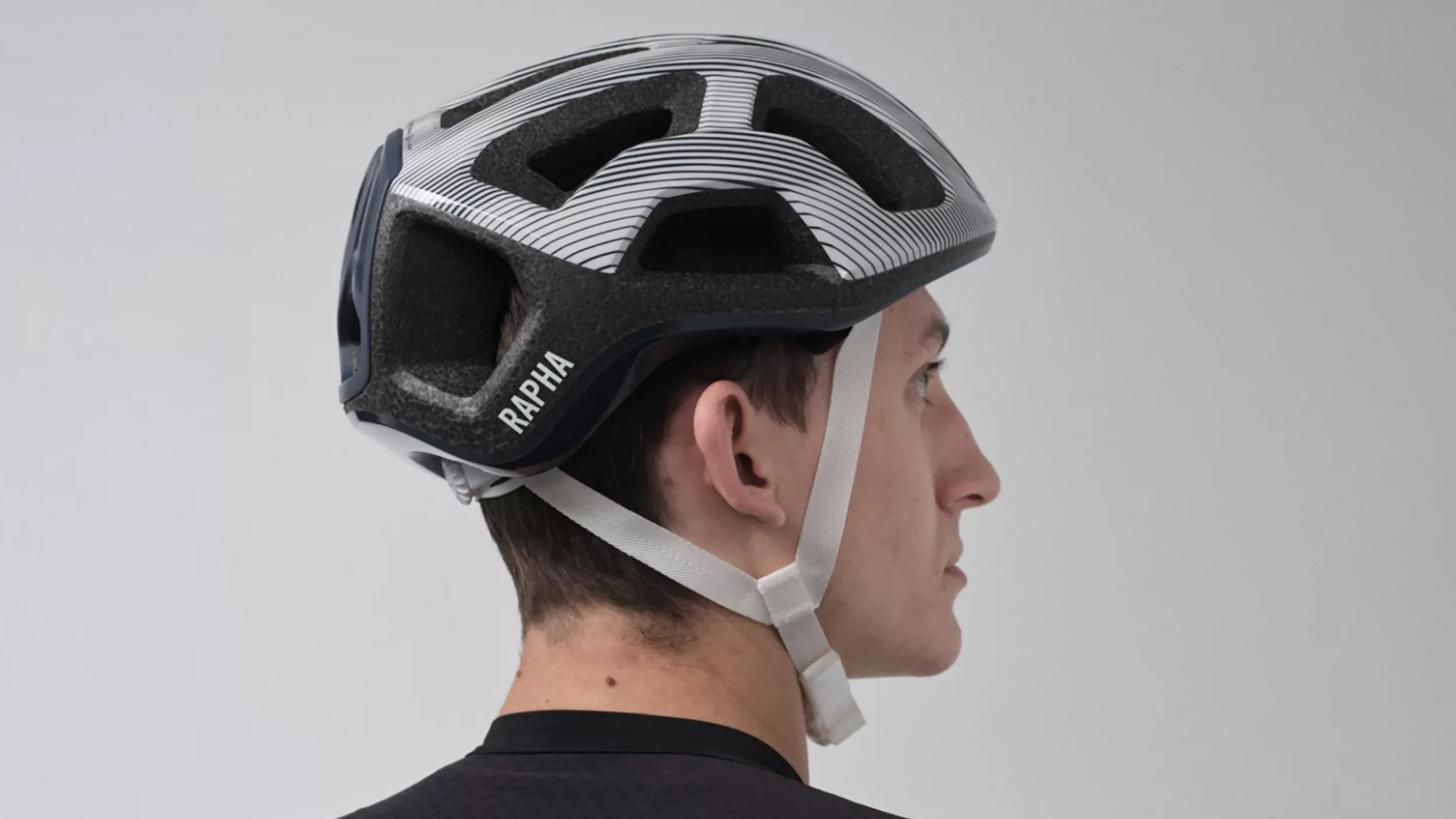 a man wearing a Rapha + POC ventral lite