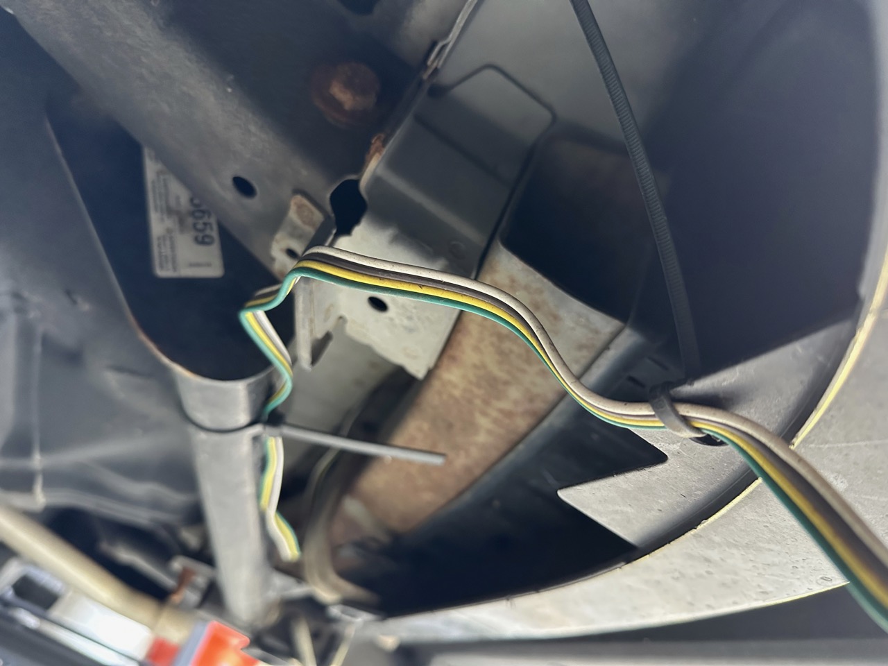zip ties underneath the car
