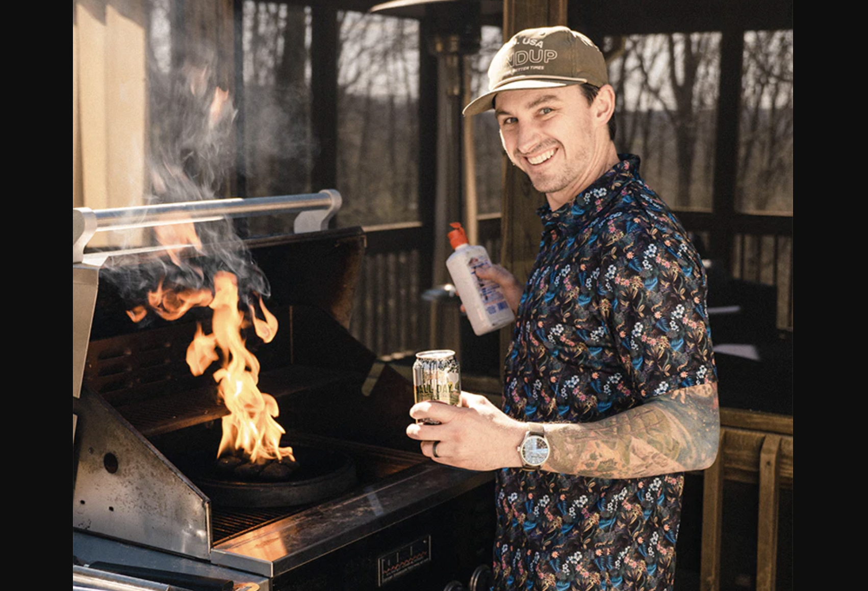 man in hawaiian shirt grilling
