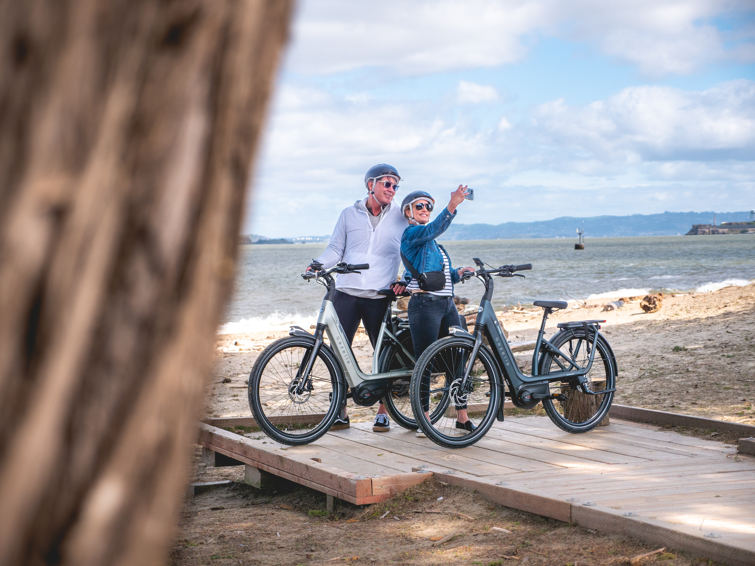 two people taking a selfie on e-bikes