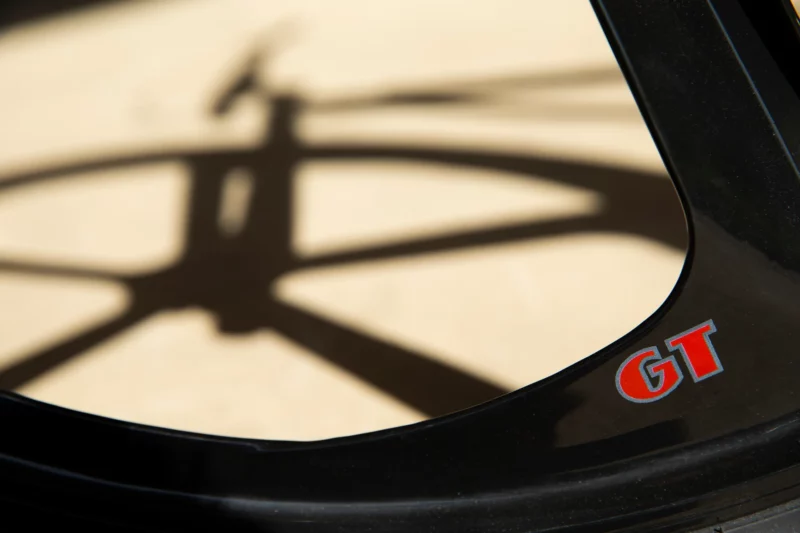 a five spoke mag's shadow on sand