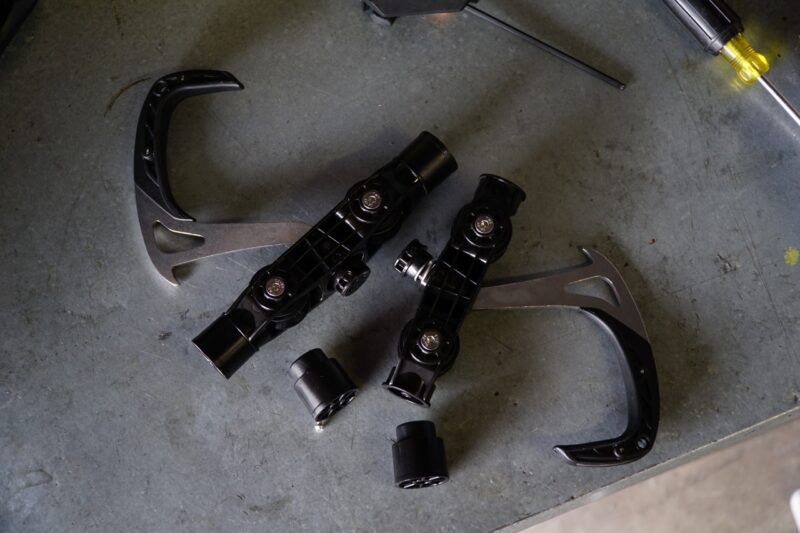 Stashed SpaceRail Storage System hook with and without spacers