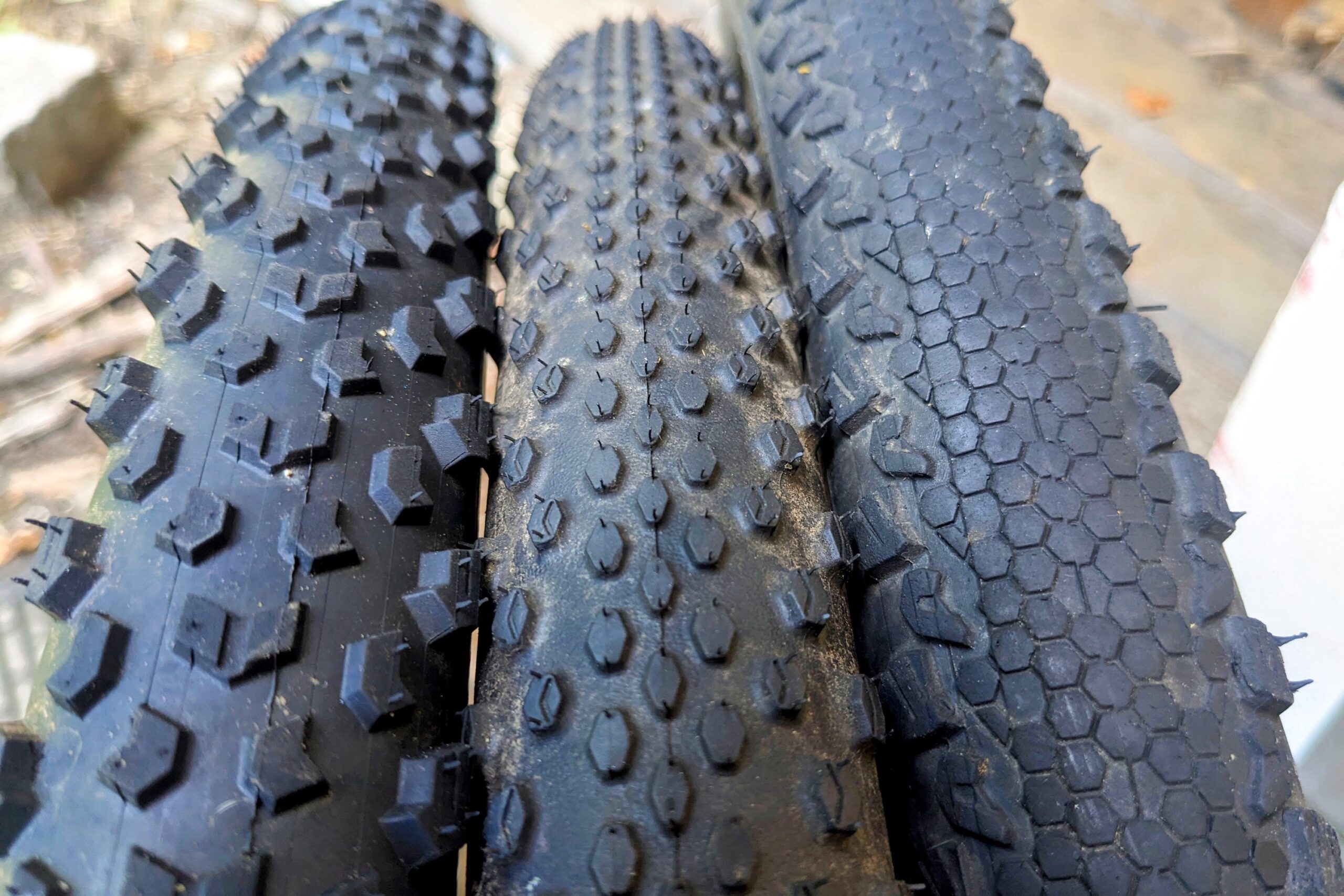 Comparison shot of three different gravel bike tire treads