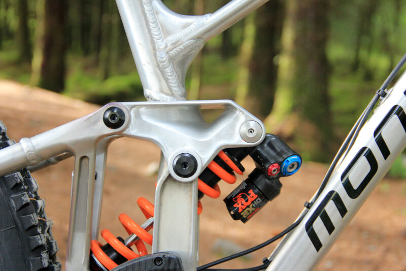 brook macdonald bike check fort william world champs 2023 prototype mondraker frame cnc machined rocker fox dhx2 coil shock 500 lbs spring