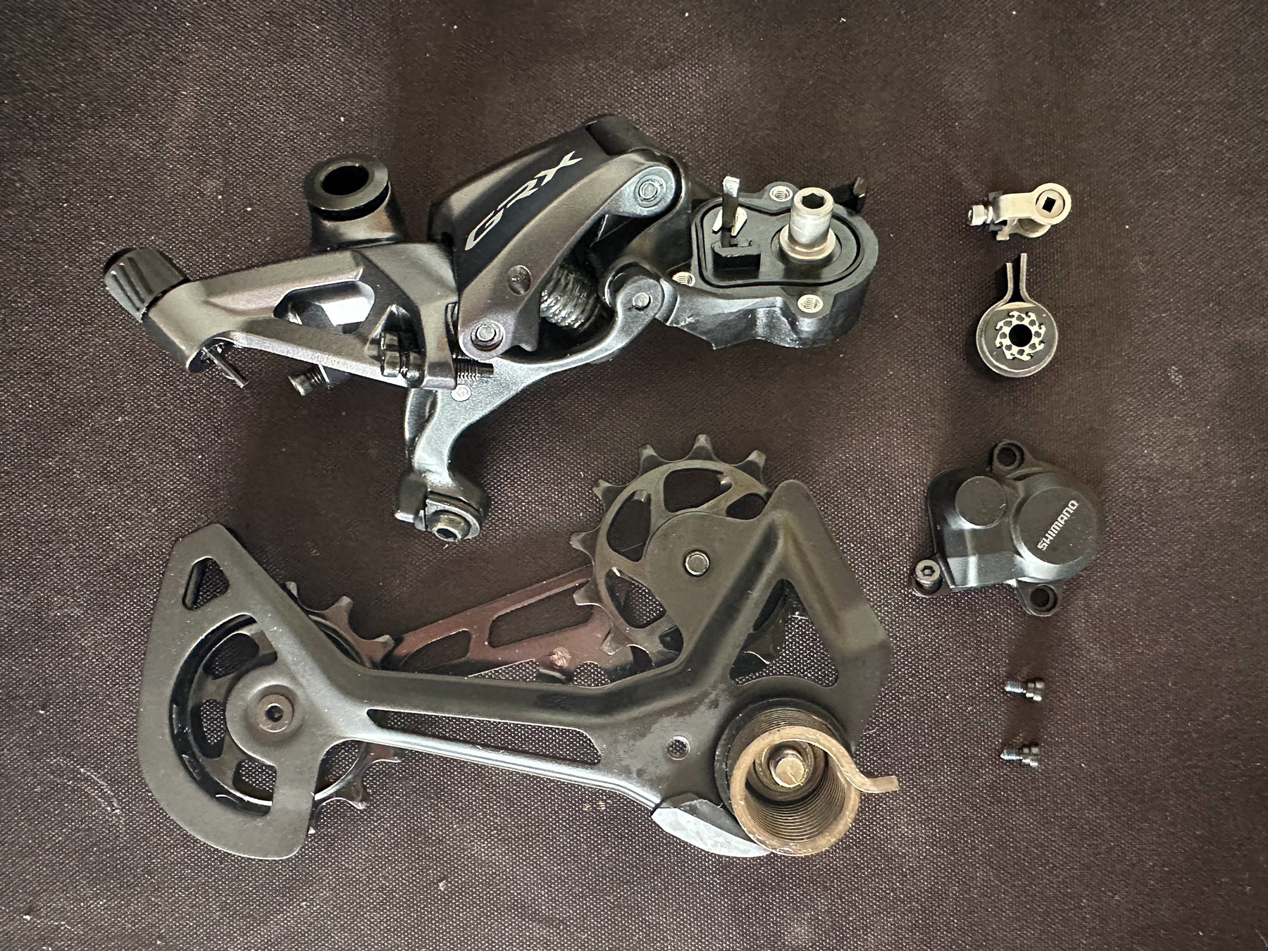 GRX derailleur pulled apart to show pieces