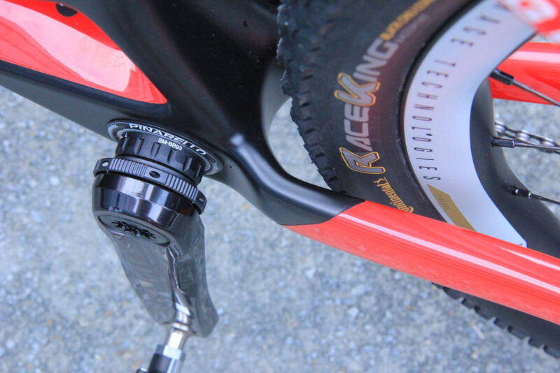 tom pidcock pro bike check pinarello dogma xc hardtail asymmetric rear triangle details chainstay tire clearance
