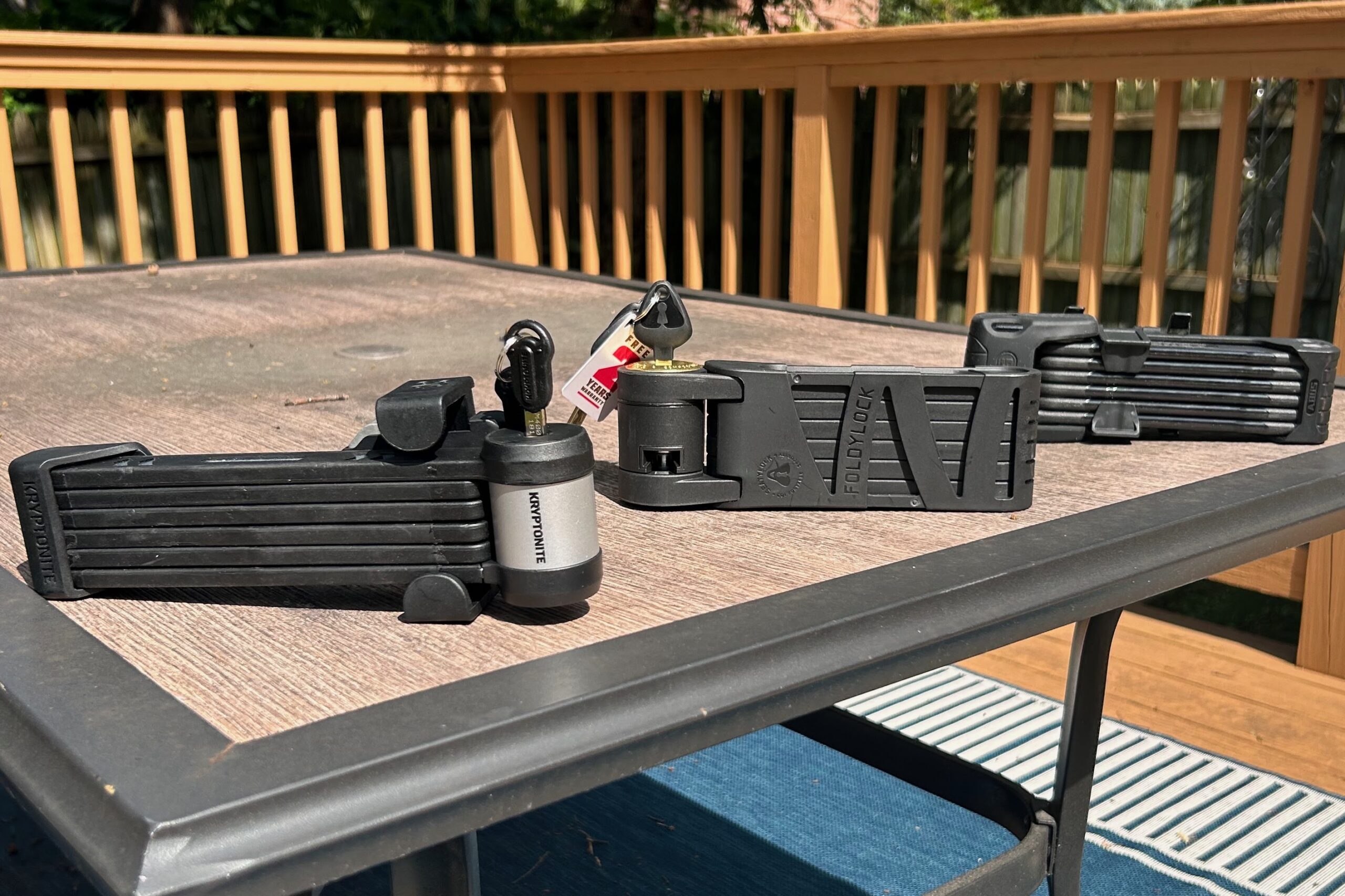 Three folding bike locks with keys