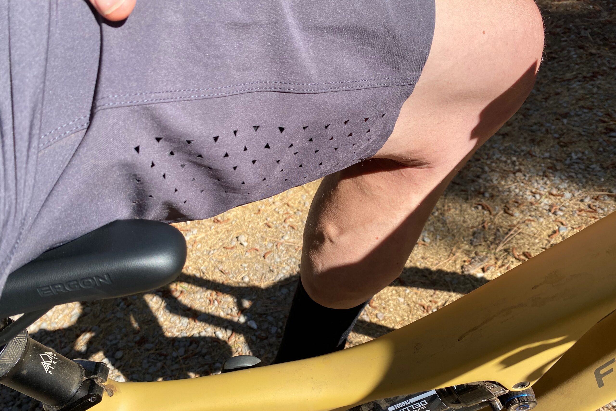 Laser cut ventilation holes on the Pearl Izumi Summit Shell shorts