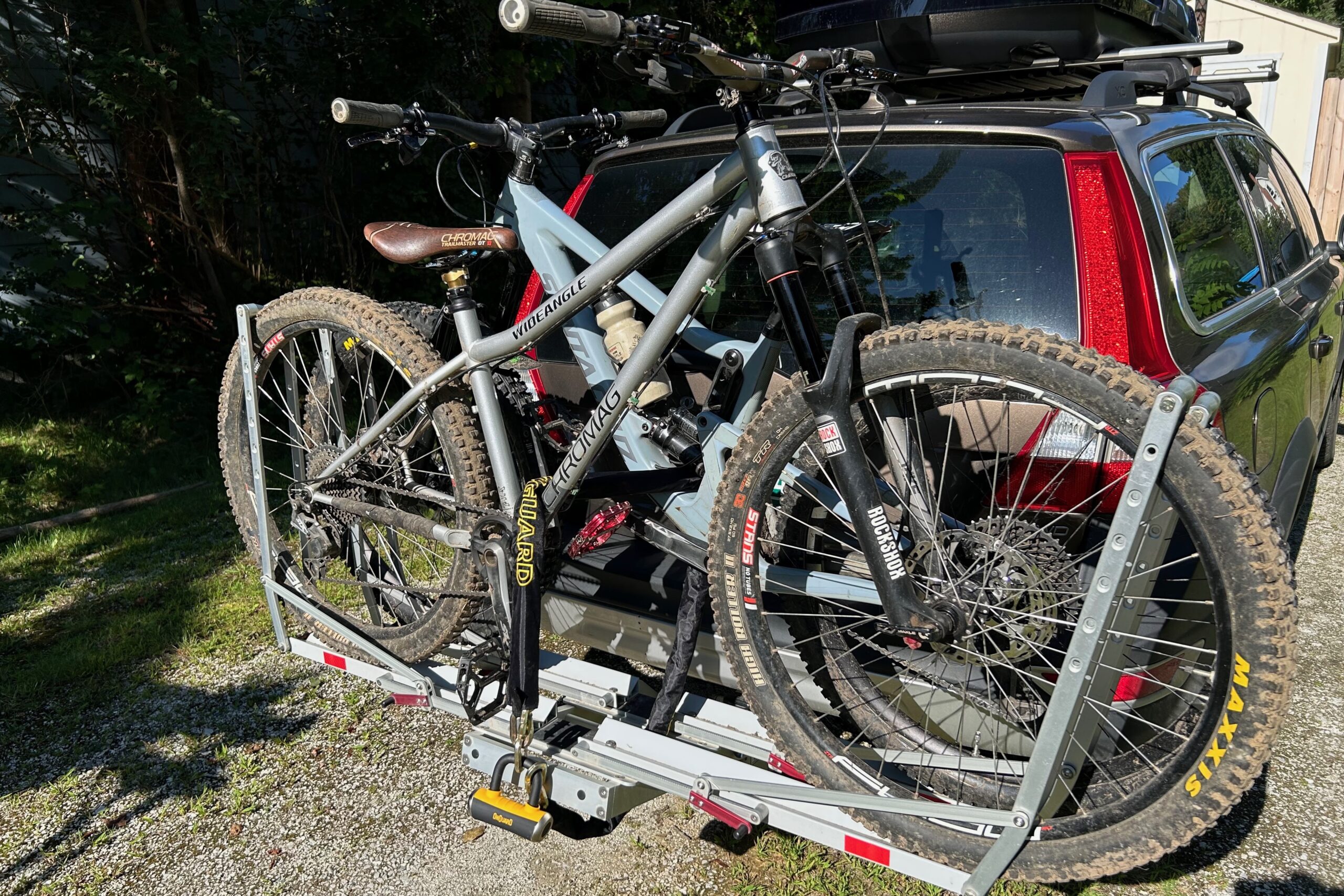 The OnGuard Mastiff 8019L chain lock in use locking two bikes on a hitch bike rack