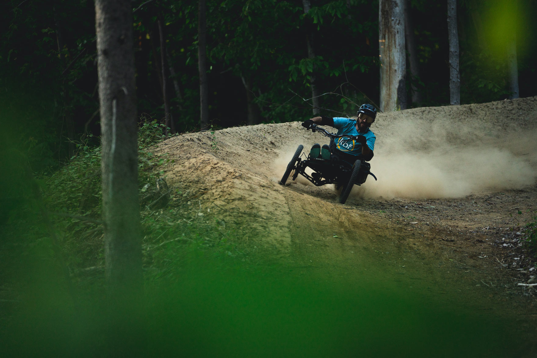GREG DURSO riding an adaptive mountain bike on driving range trails in Vermont