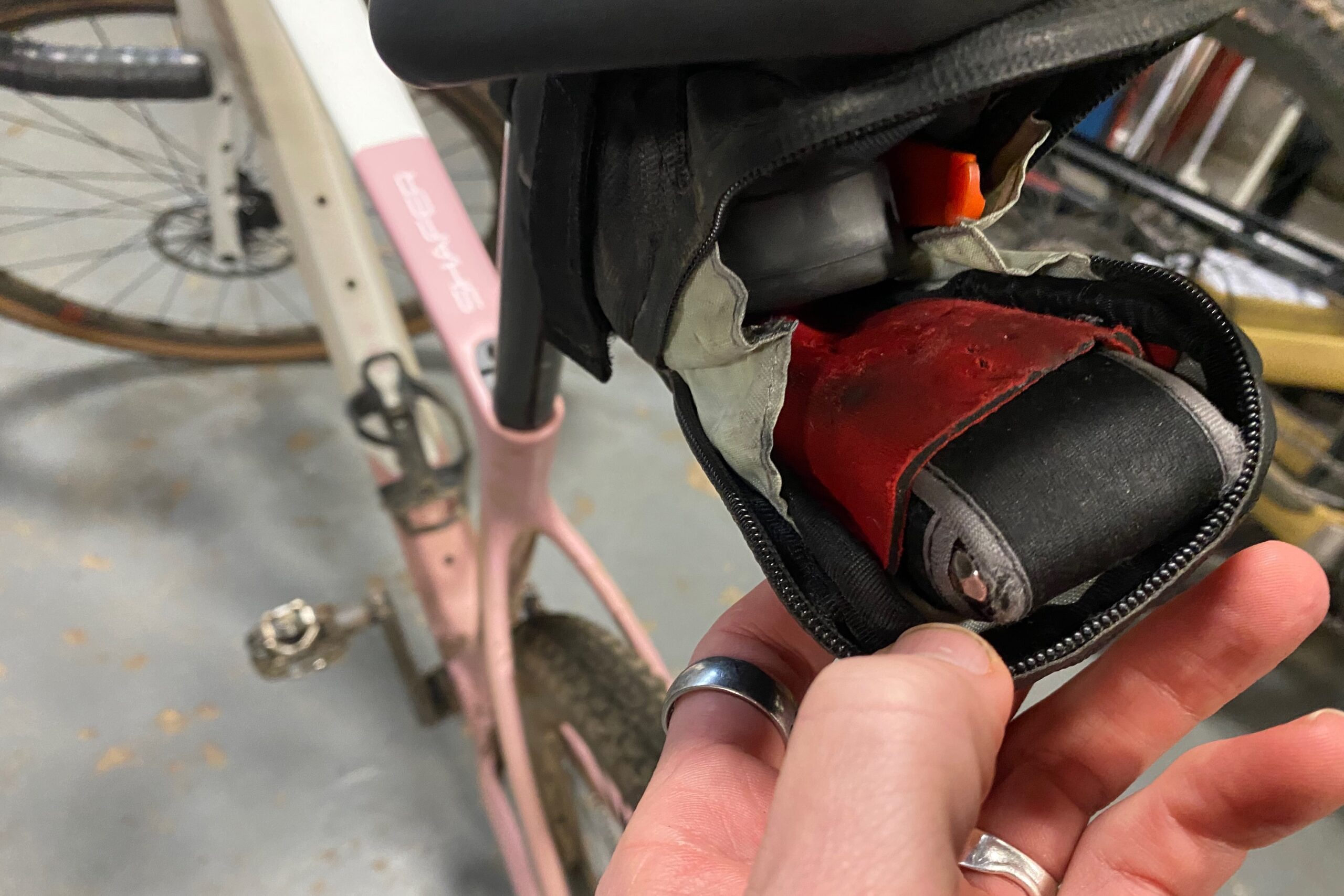 A bike multi-tool being carried in a saddle bag