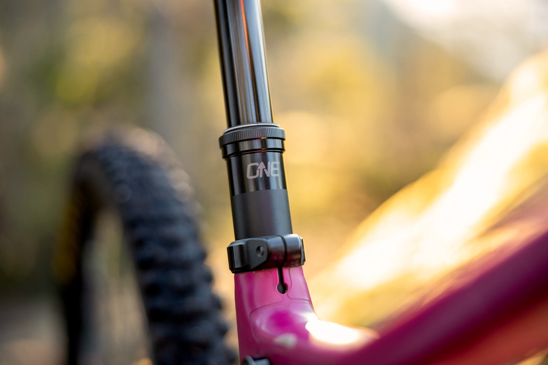 closeup of a oneup v3 dropper seatpost on a bike
