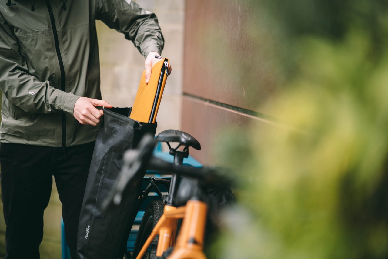 Tailfin 16-liter Pannier launch laptop holster going in