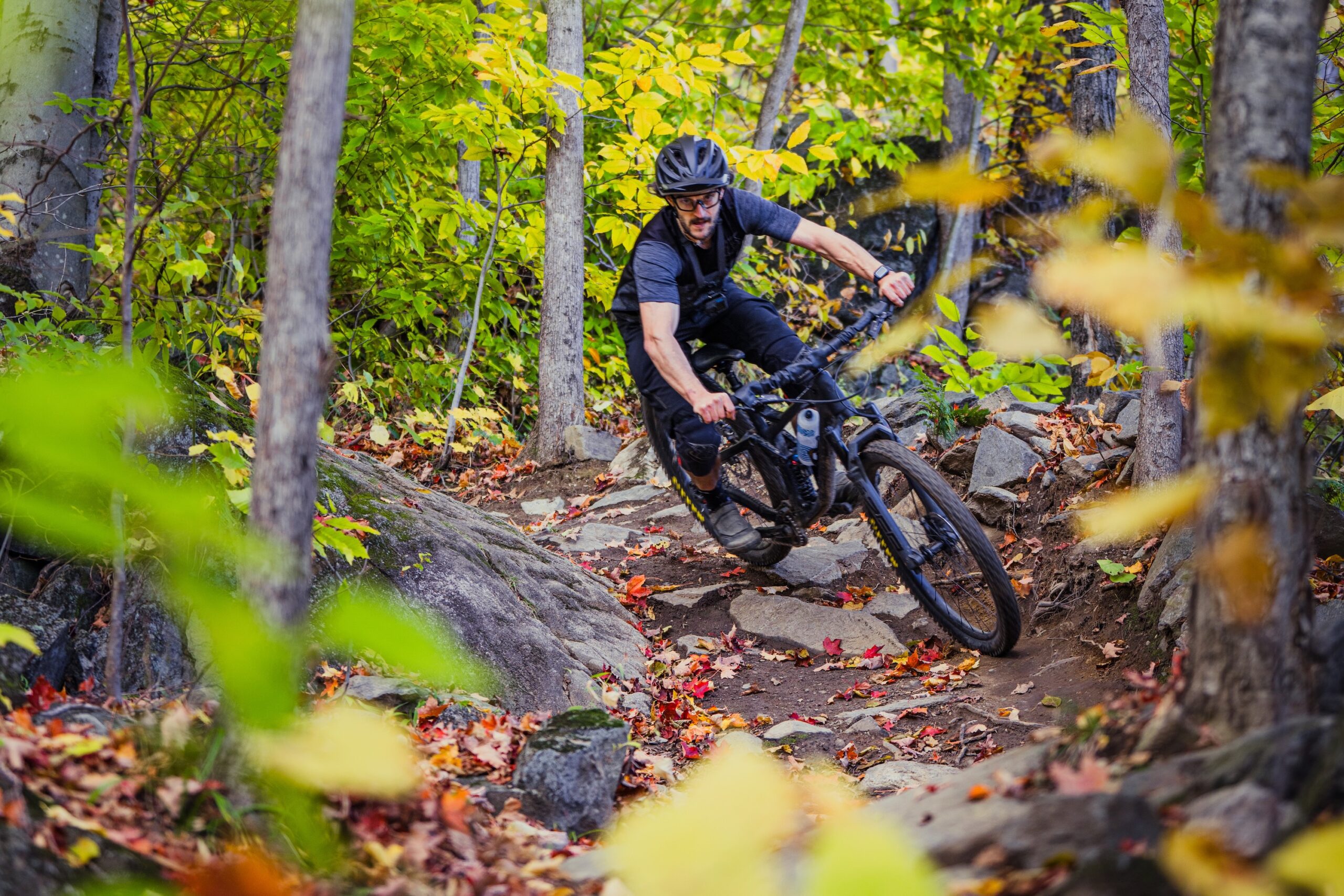 Simon Ayotte test riding mountain bike handlebars with proper setup of his controls