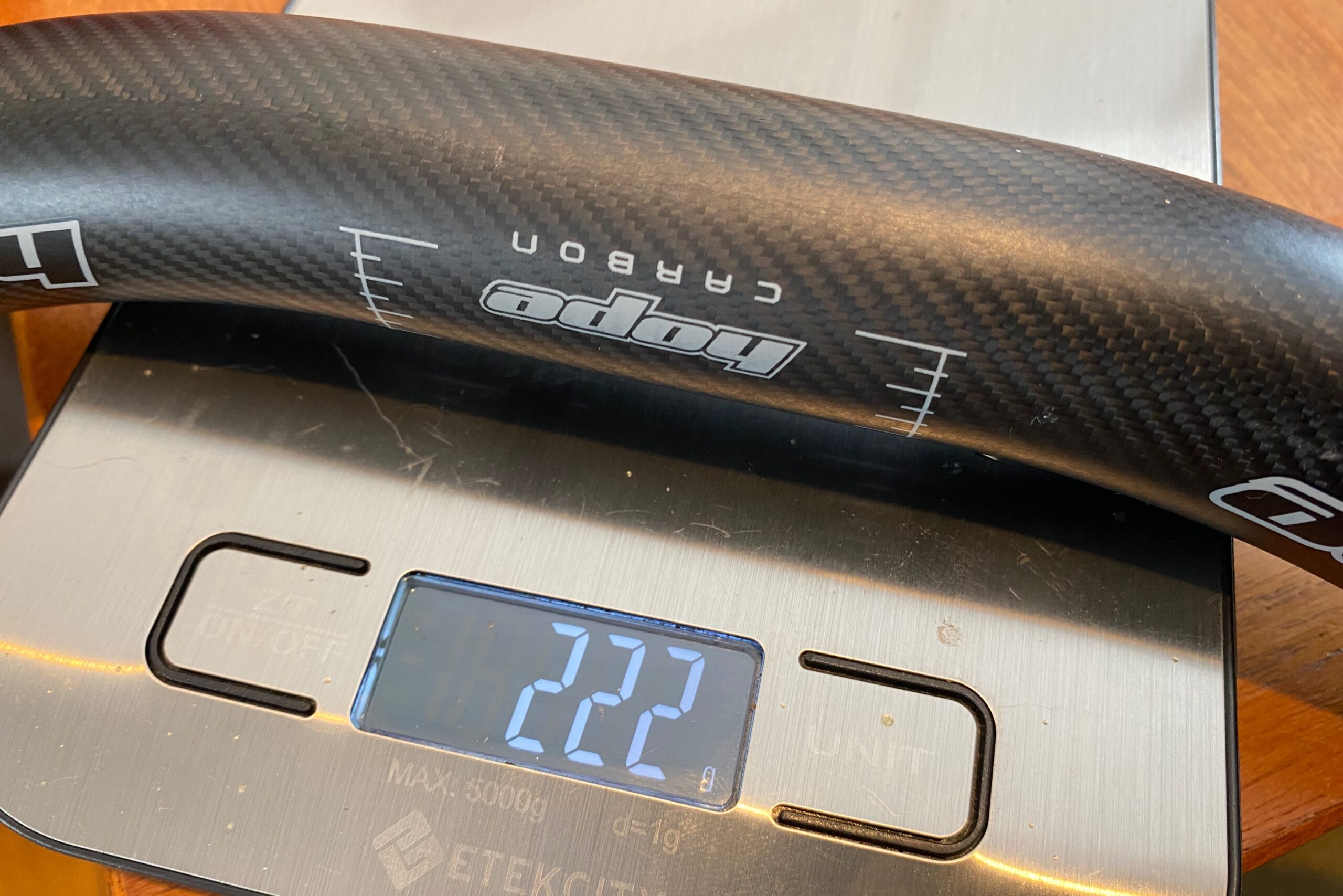 The Hope Carbon Handlebar on a scale, weighing in at 222 grams.