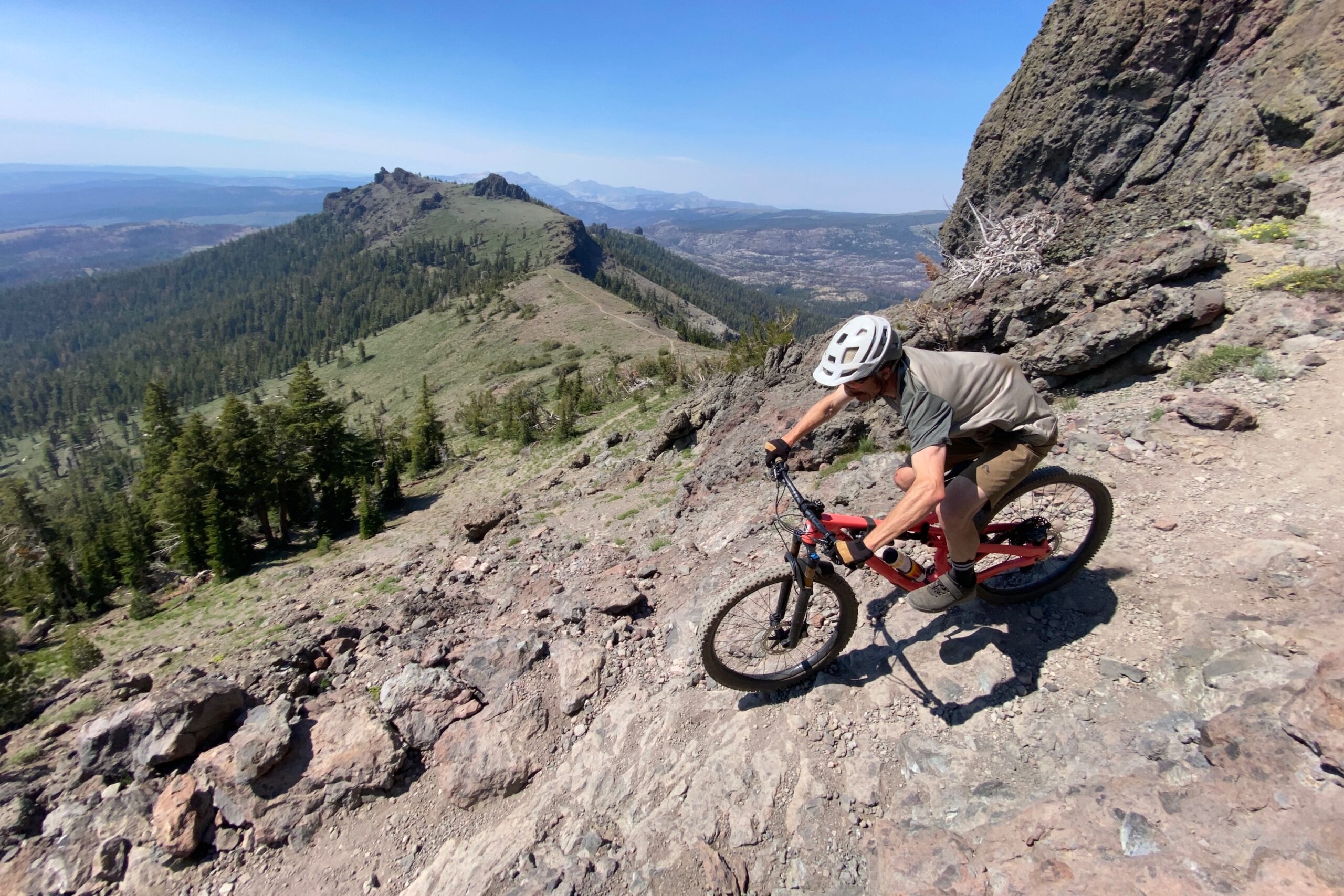 Riding with the OneUp Carbon handlebar on a ridge top trail