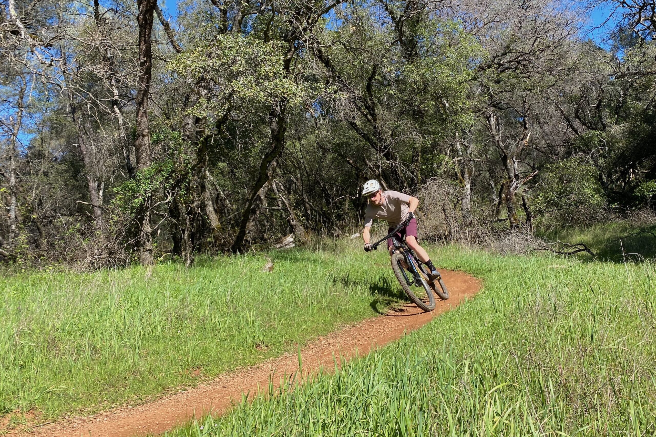 Riding the Yeti ASR around a turn on a smooth singletrack trail
