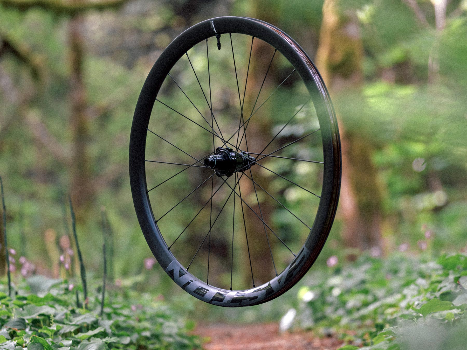 Easton EC90 ALX mid-depth aero carbon gravel wheelset, angled rear wheel