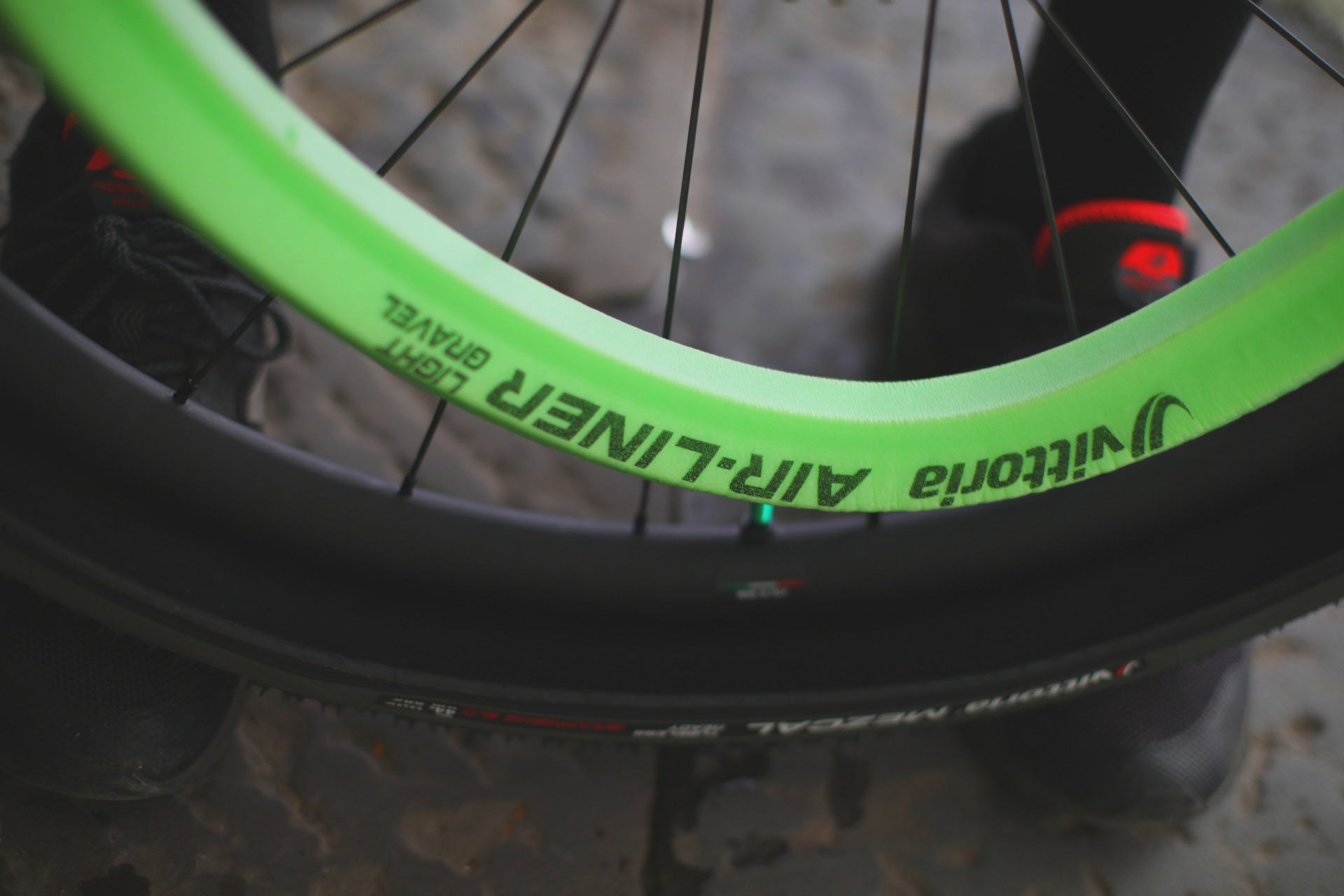 vittoria air liner light gravel tire insert shown next to a tire.