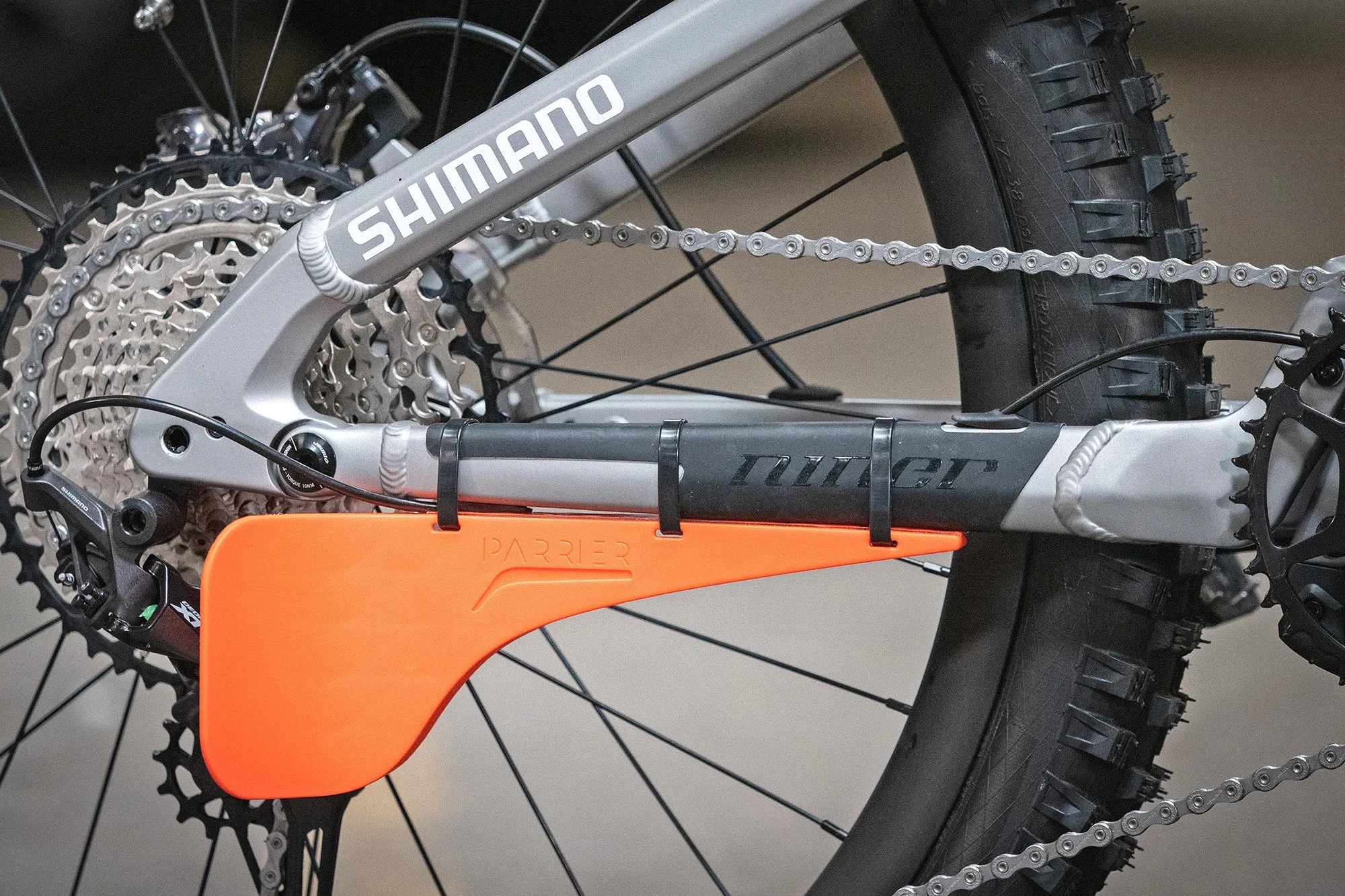 David Cachon adventure MTB rider on Niner bikes fitted with orange Parrier Derailleur Guard protector