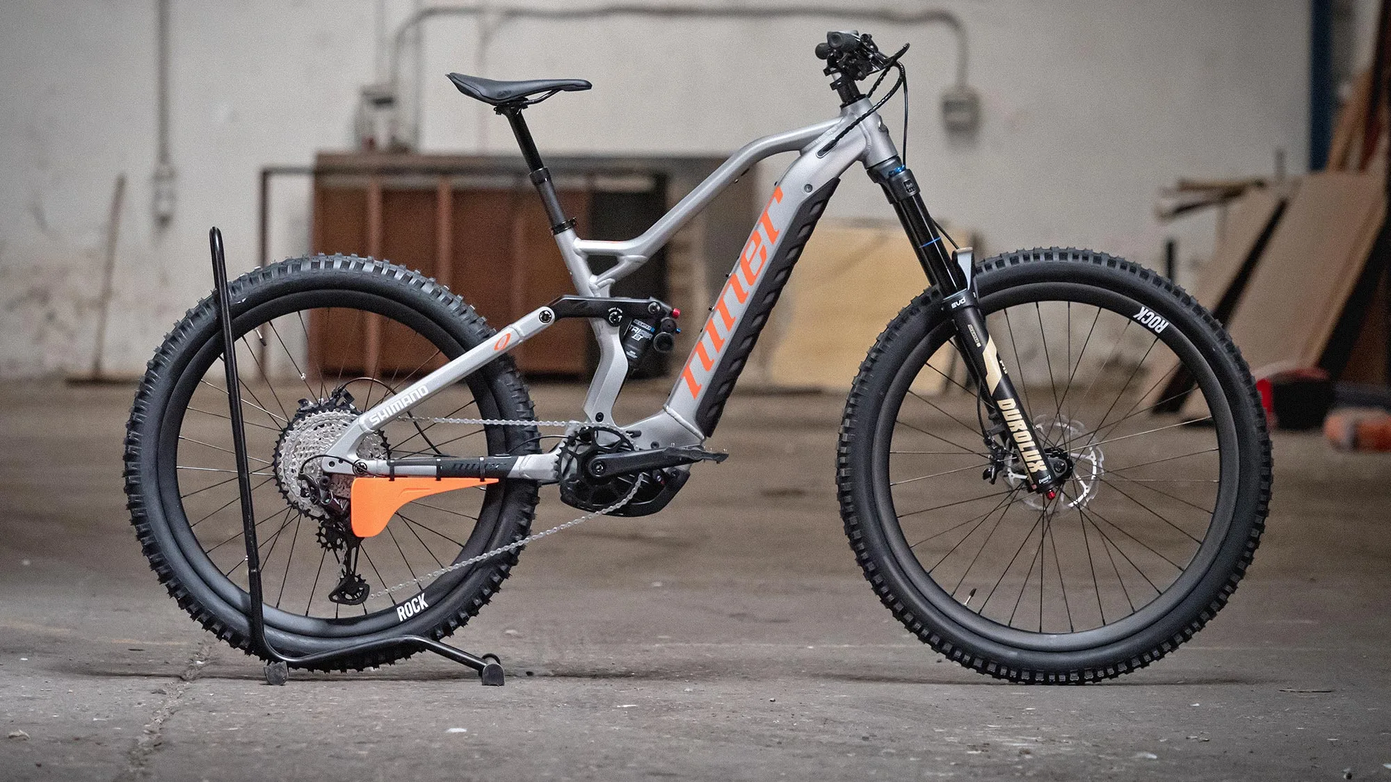 David Cachon adventure MTB rider on Niner bikes fitted with orange Parrier Derailleur Guard protector, complete ebike