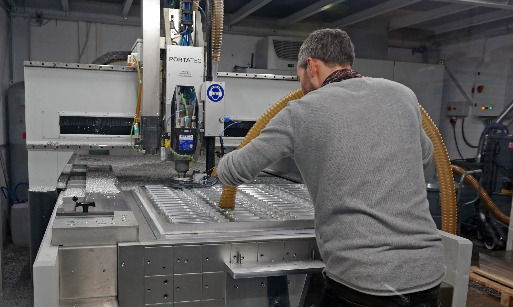 Actofive Factory Tour: CNC machined alloy mountain bikes made in Dresden Germany, checking and vacuuming crank arm production