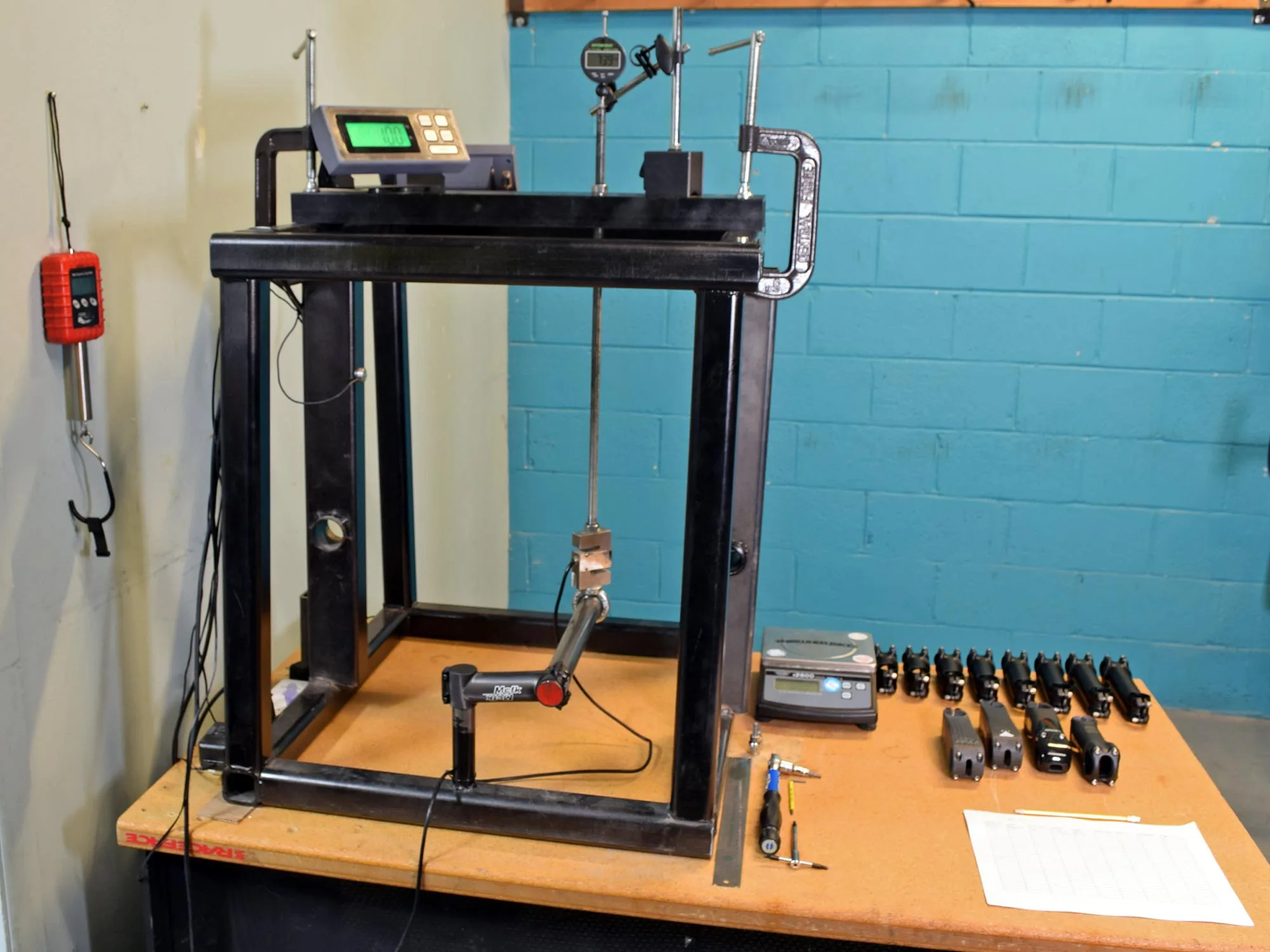 2024 Fair Wheel Bikes Stem Stiffness Tests, independent road bike stem deflection testing, test rig in teh back of the bikeshop