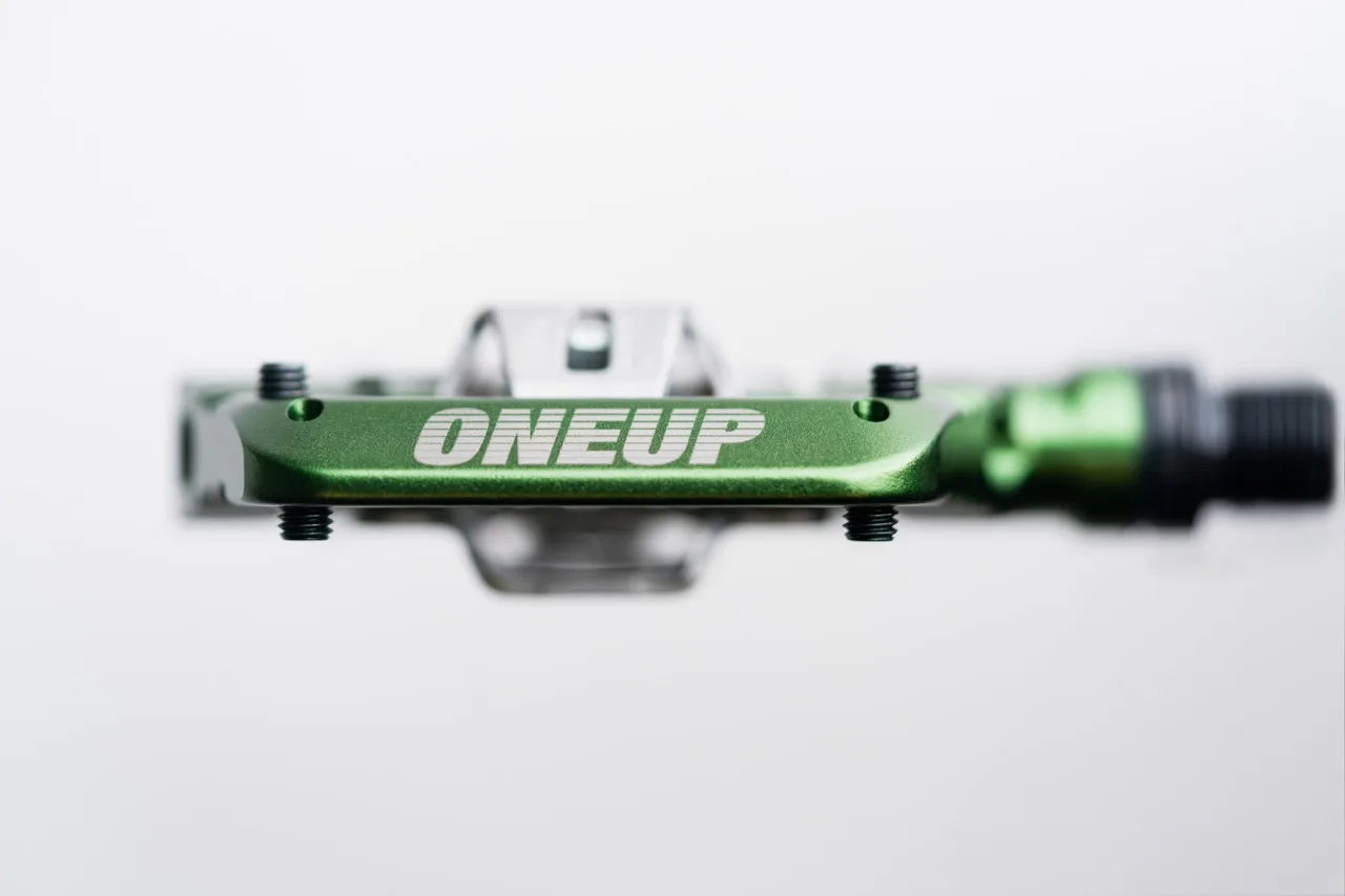 OneUp Components Clip Pedal logo