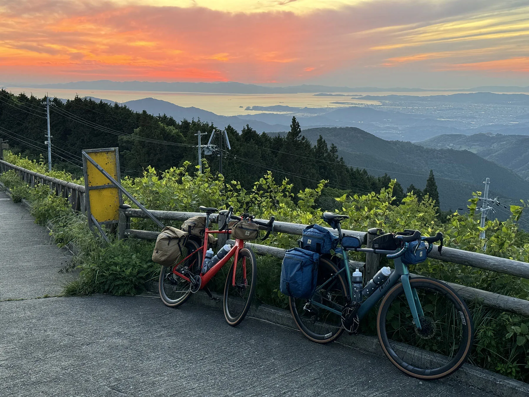 north st bikepacking bags on lauf road bikes with japan sunset in background.