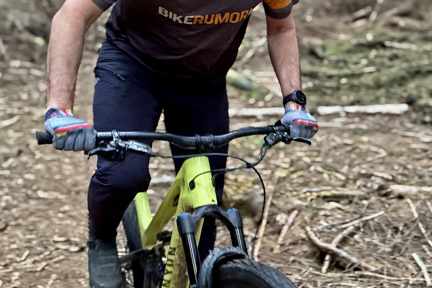 BikeYoke Barmate Carbon 50 compliant 35mm mountain bike handlebar review, up close riding in a dark forest