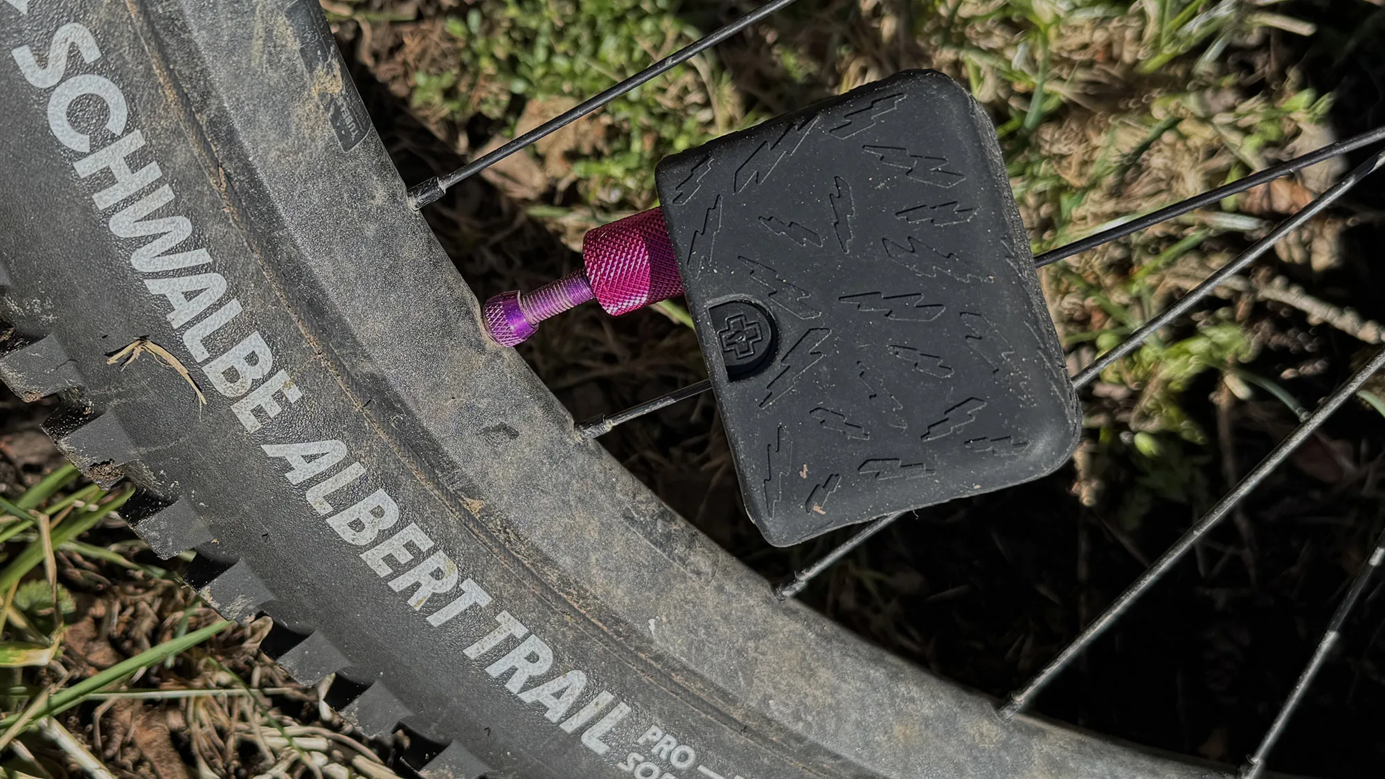 Muc-Off AirMach Electric Mini Pro Inflator tire pump Review, on a trail bike tire's presta valve