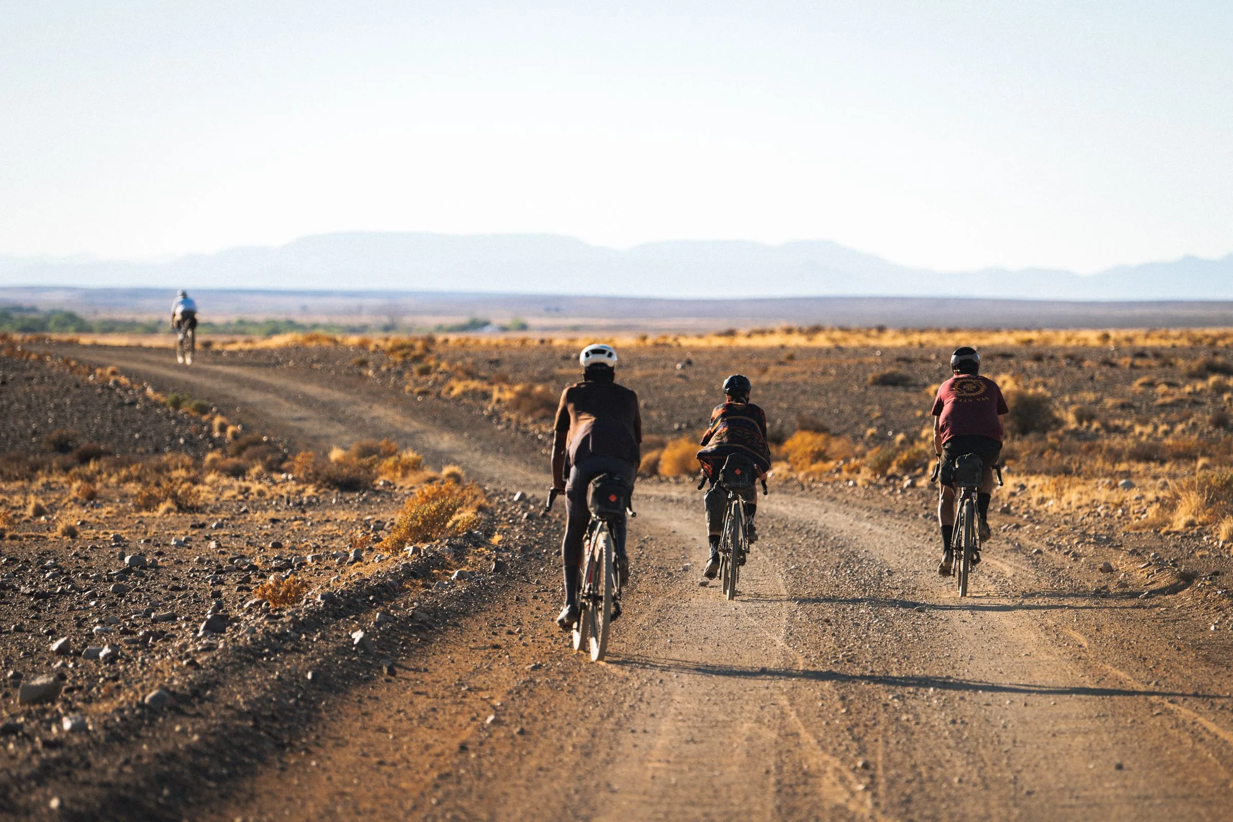 Bikepackers with Tailfin systems ride through the desert