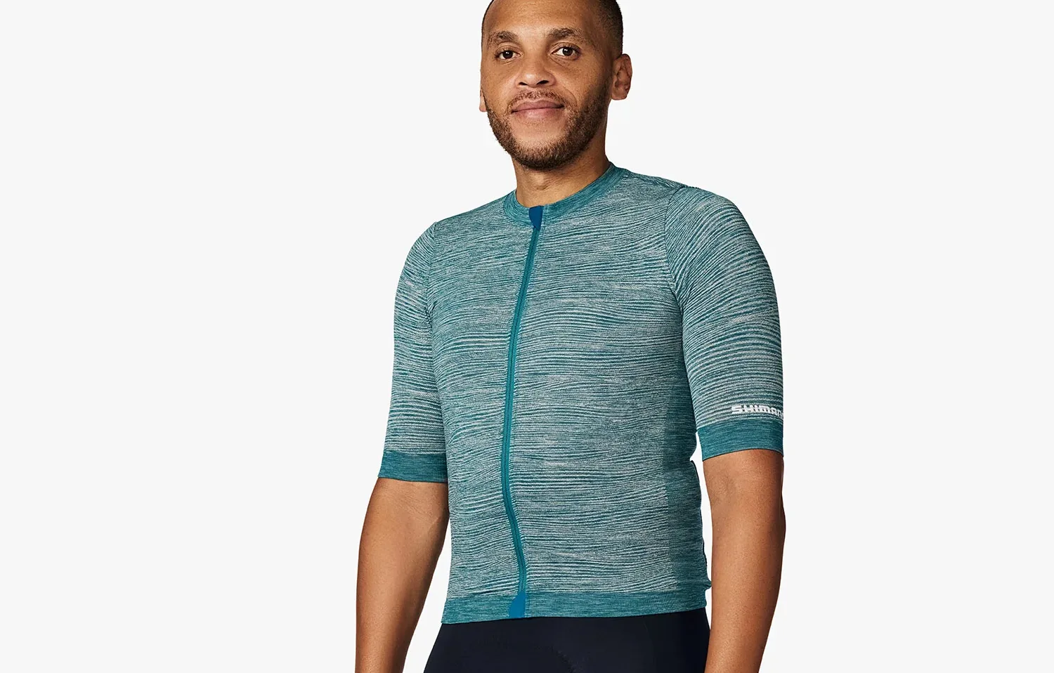 studio shot of a model wearing Shimano's Evolve gravel jersey